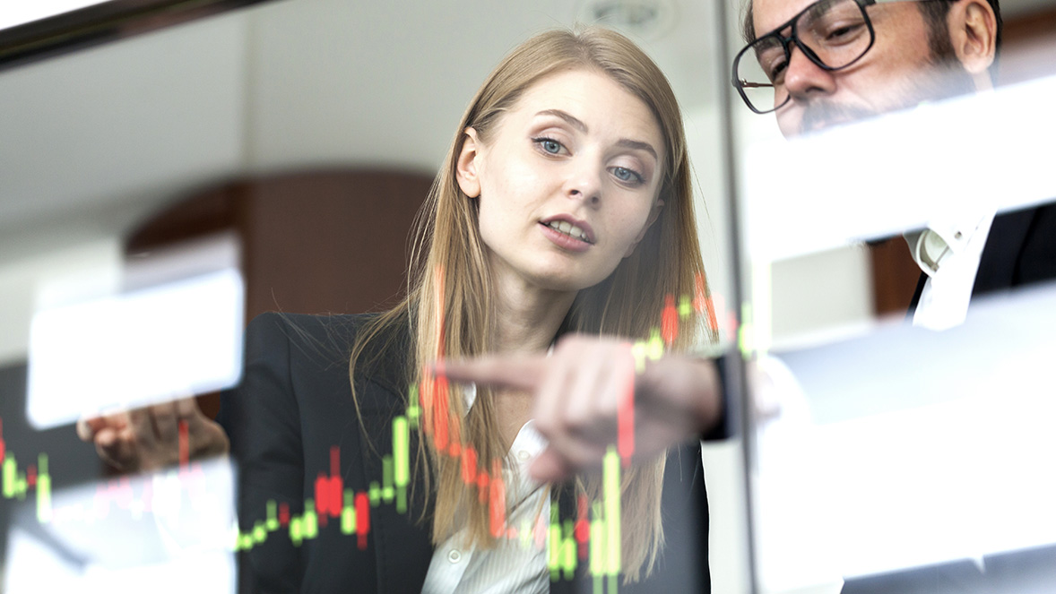 colleagues looking at a virtual graph