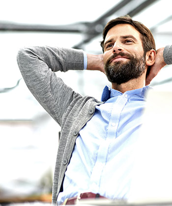 man leaning back in his chair
